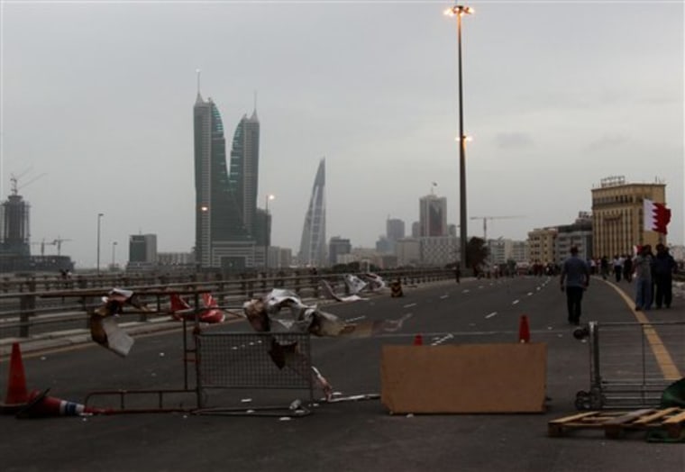 A barricade set up by Bahraini anti-government protesters Sunday, March 13, 2011, prevents traffic from entering the capital of Manama.
